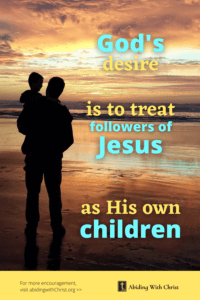Link to Pinterest pin image of man holding his son on the beach at sunset with text that reads "God's desire is to treat followers of Jesus as His own children". 