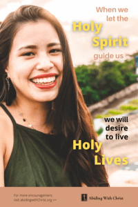 Link to Pinterest pin image of a smiling woman with text that reads "When we let the Holy Spirit guide us, we will desire to live holy lives". 
