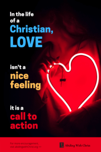 Link to Pinterest pin image of a person standing behind a neon heart with text that reads "In the life of a Christian, love isn't a nice feeling, it is a call to action". 