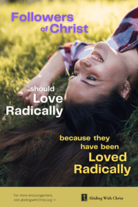 Link to Pinterest pin image of young woman lying down in grass with face hanging upside down with text that reads "Followers of Christ should love radically because they have been loved radically". 
