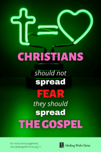 Link to Pinterest pin image of a neon sign with a cross, equals sign, and heart with text that reads "Christians should not spread fear, they should spread the gospel". 