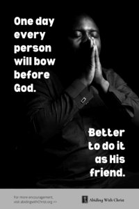 Link to Pinterest pin image of a man praying in the dark with text that reads "One day every person will bow before God. Better to do it as His friend". 