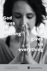 Link to Pinterest pin image of woman praying with text that reads "God owes us nothing but gives us everything". 